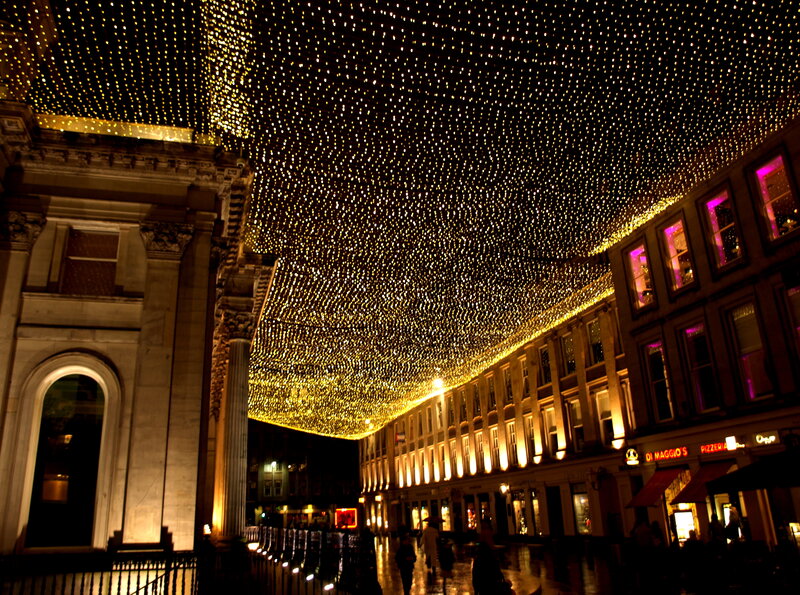 Festive lights over a city street