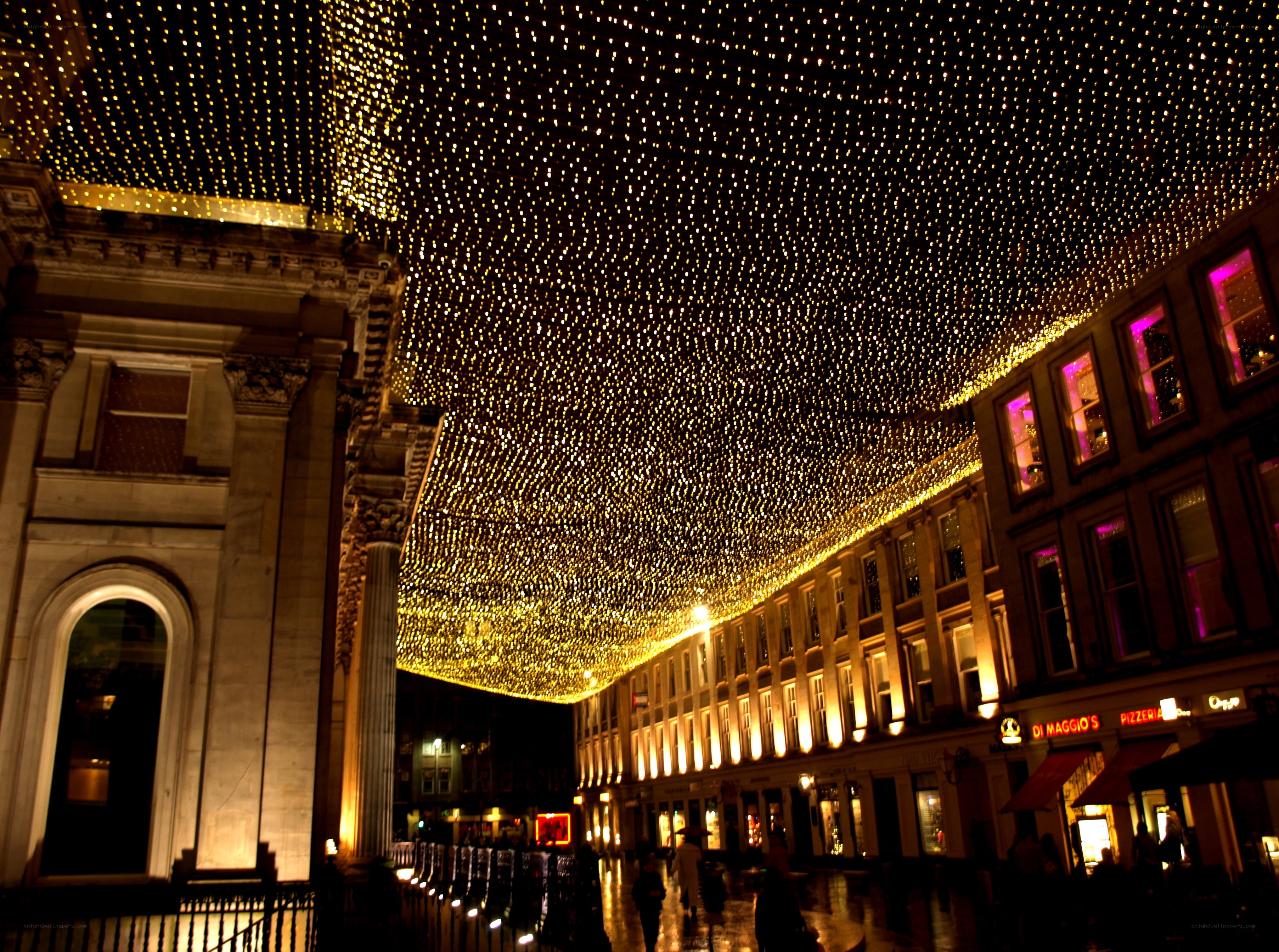 Festive lights over a city street