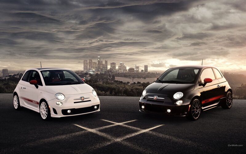 Fiat 500 Abarth cars at sunset