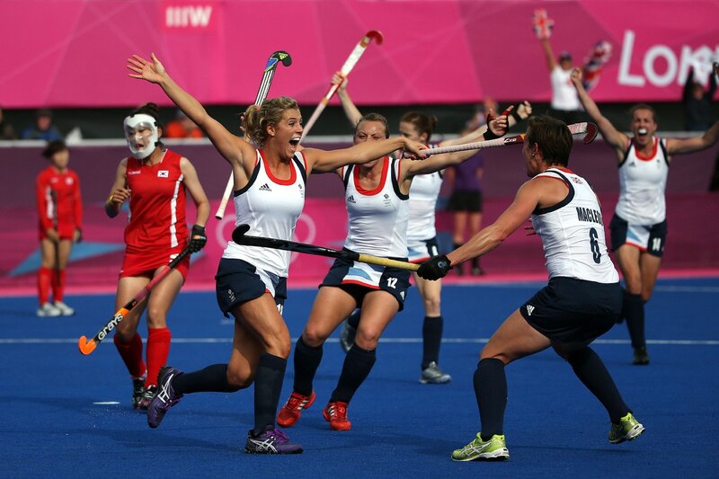 Field hockey players celebrate victory