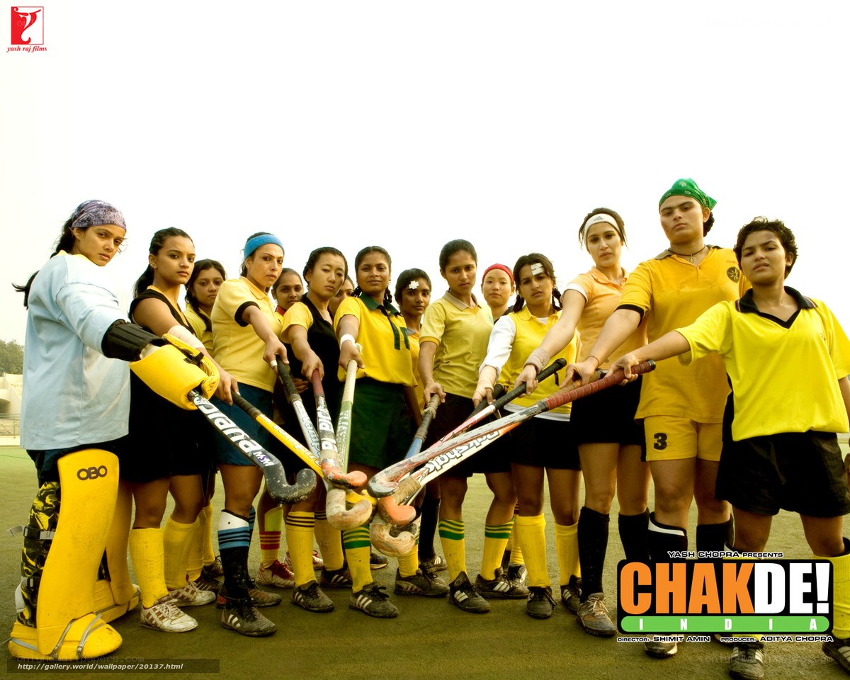 Field hockey team posing together
