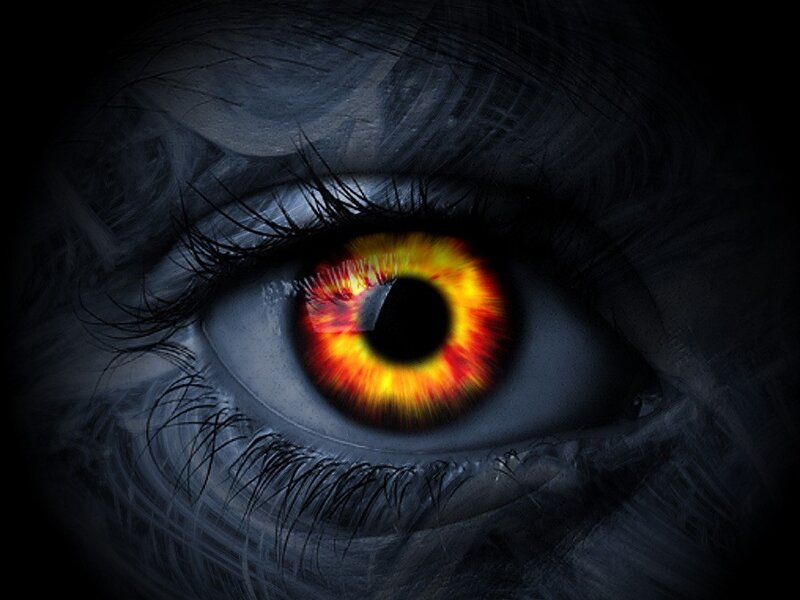 Fiery eye in dark surroundings