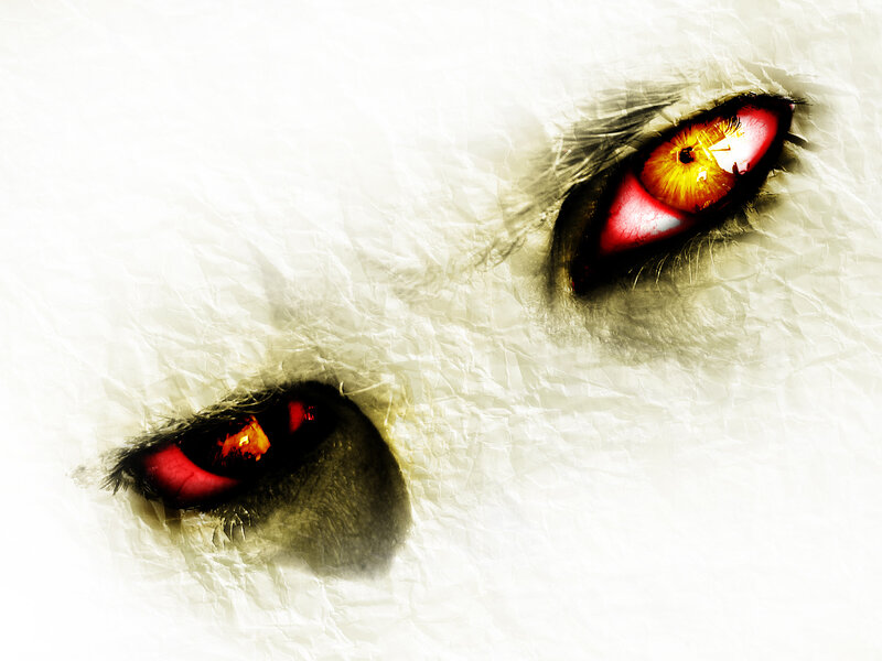 Fiery eyes in crumpled paper