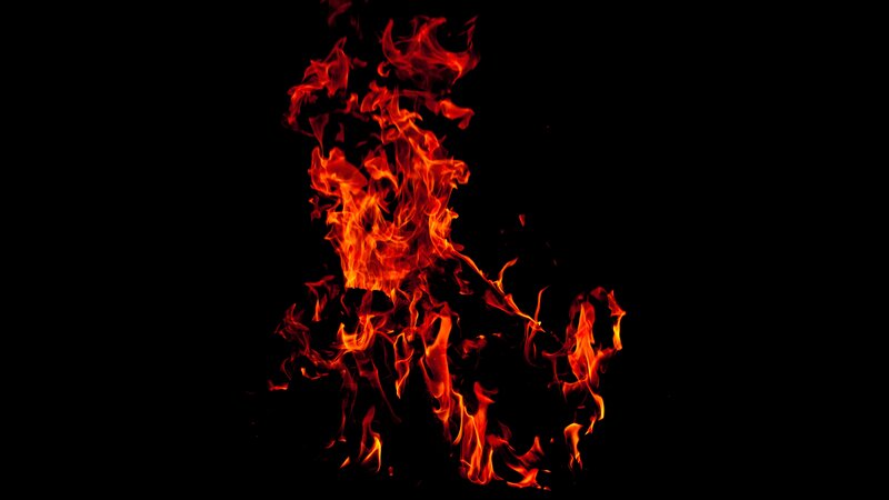 Fiery flames against black