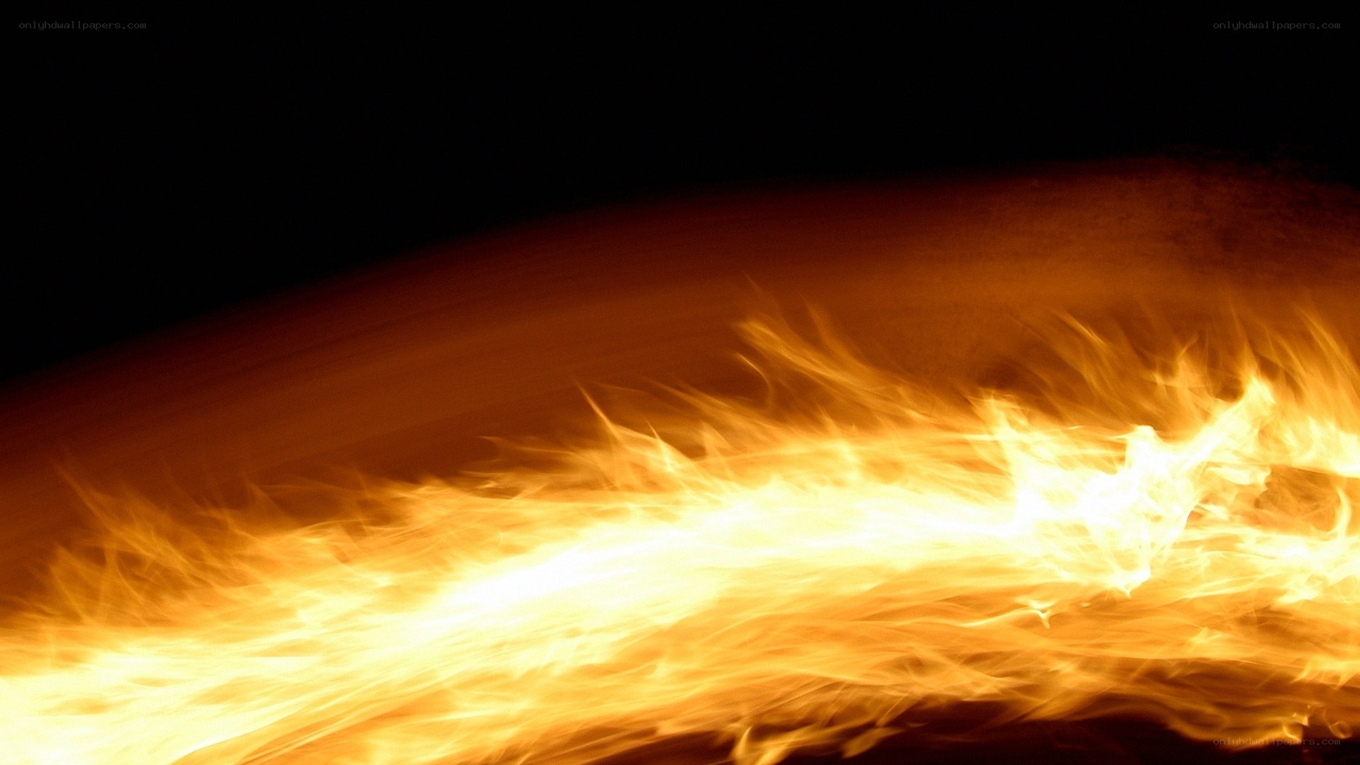 Fiery flames against black background