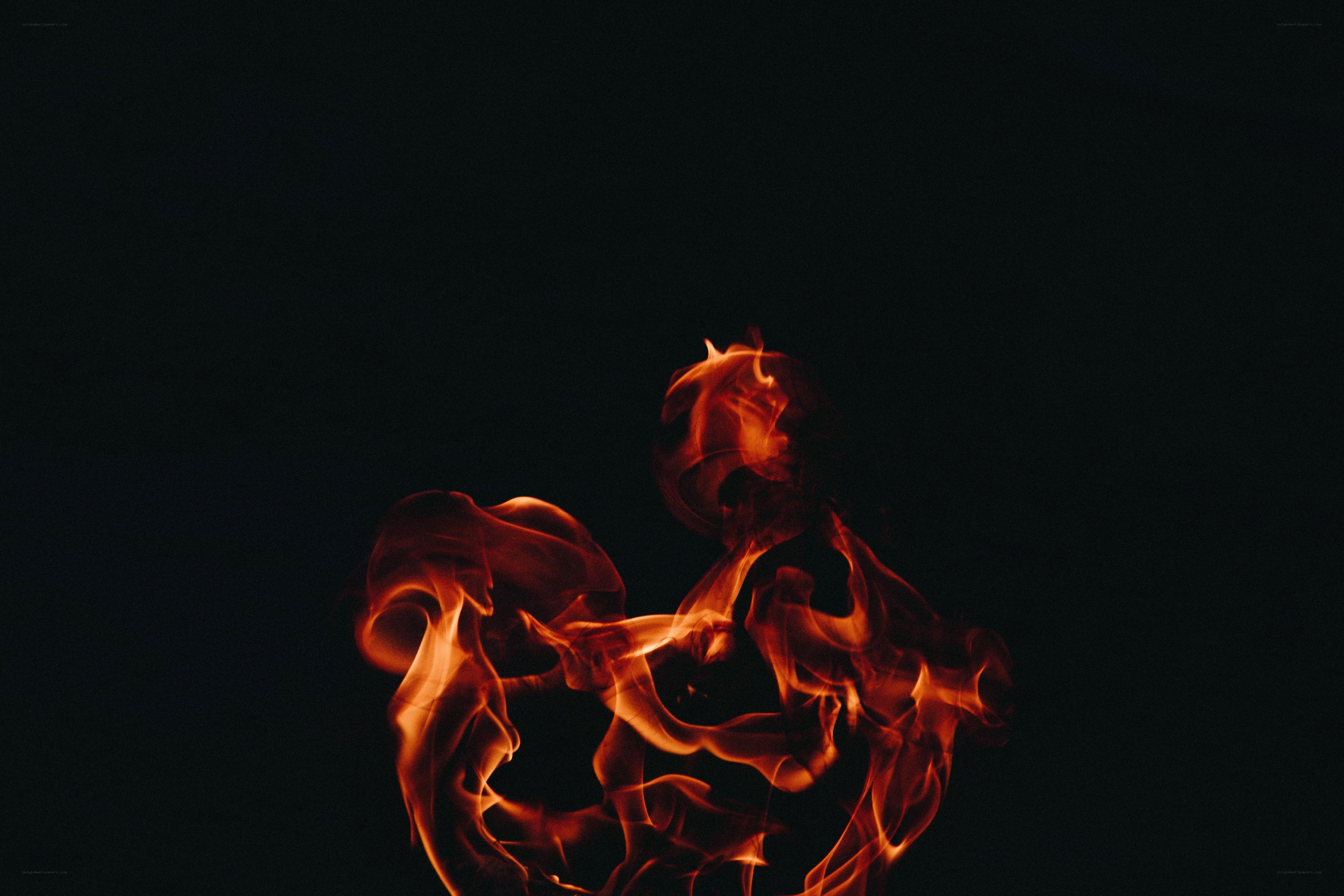 Fiery flames against black