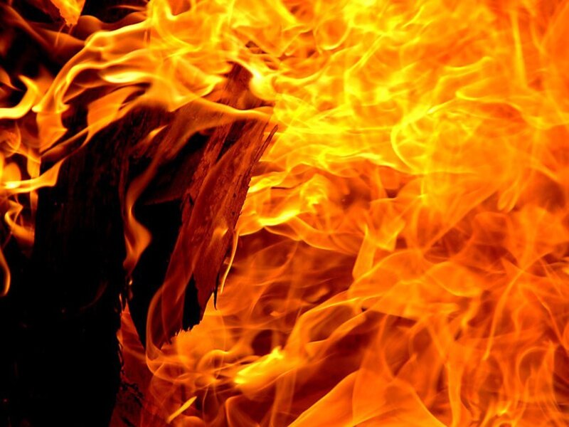 Fiery flames engulfing wood