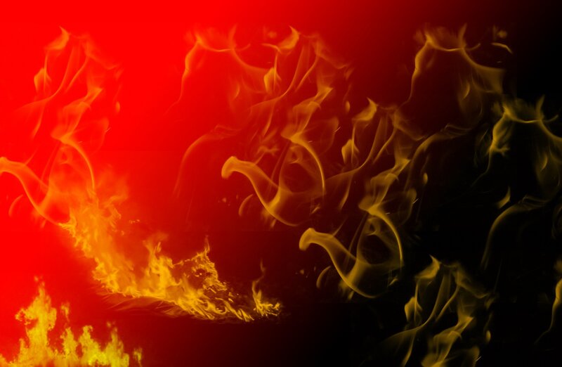 Fiery flames on red background