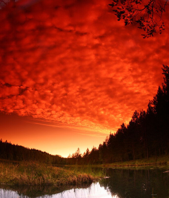 Fiery red sunset over lake