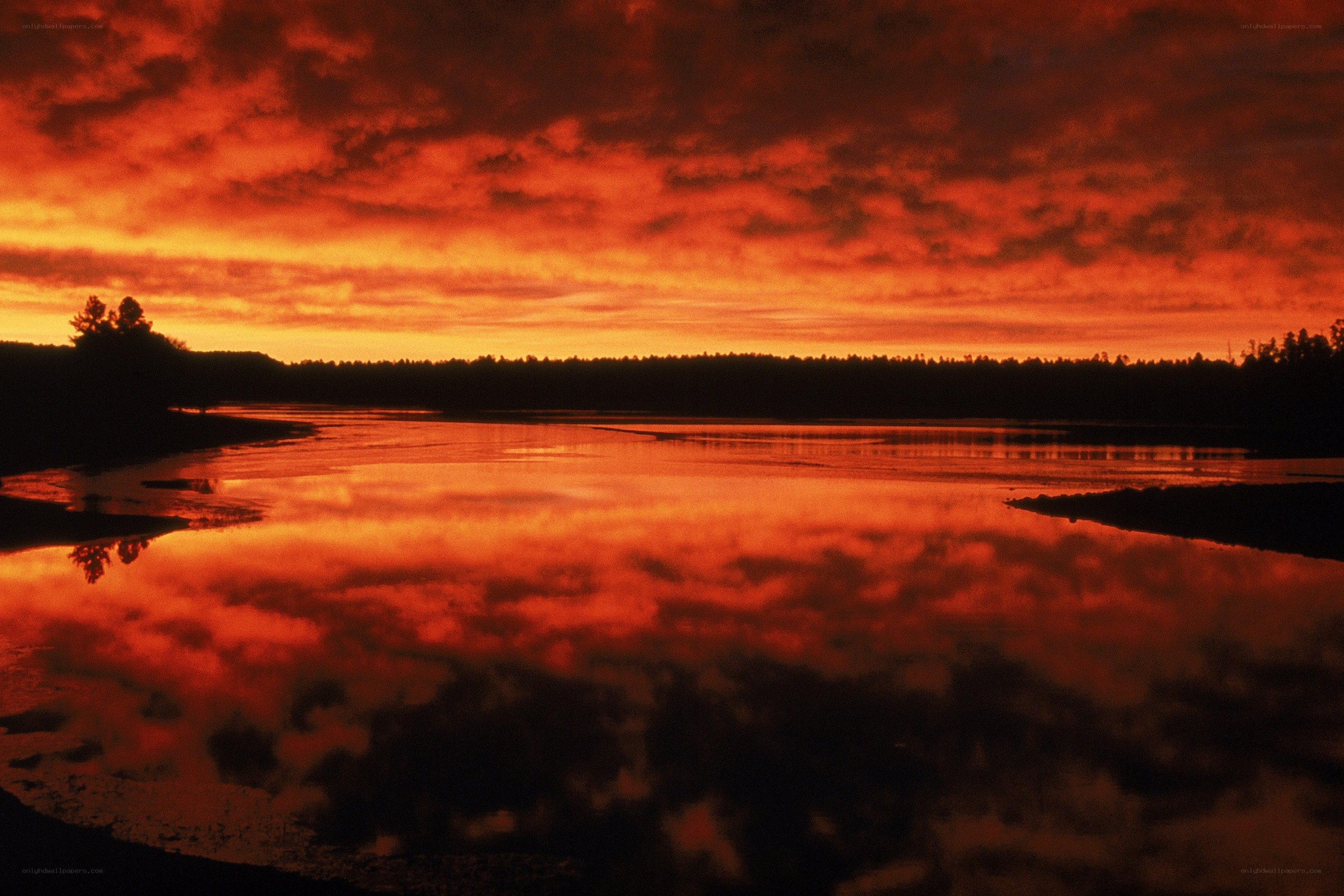 Fiery sunset over a calm lake