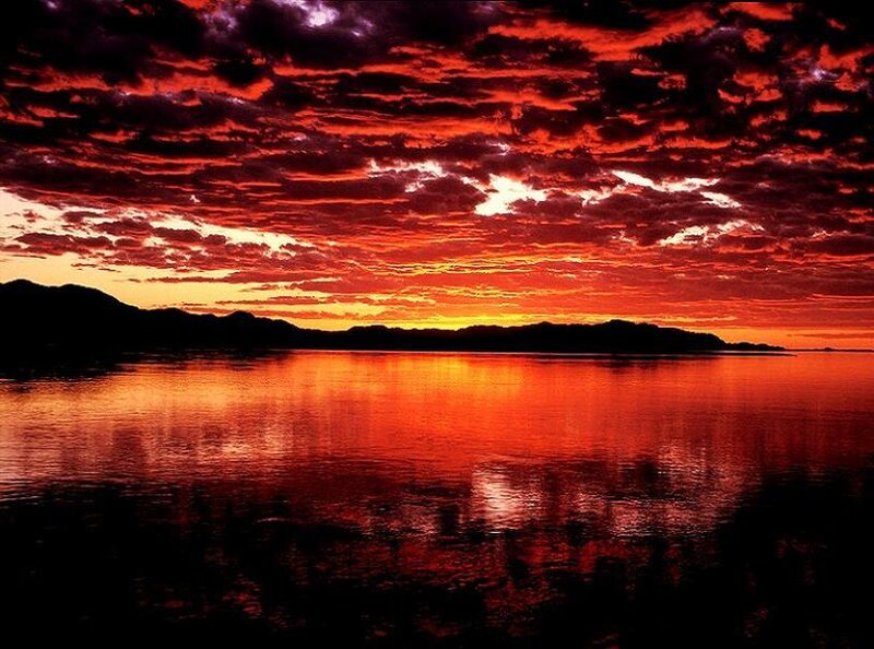 Fiery sunset over calm water