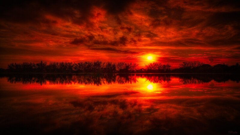 Fiery sunset over calm water