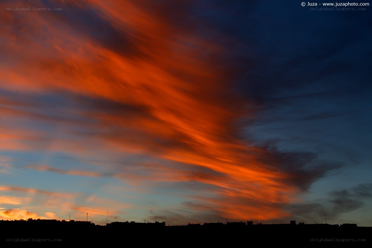Fiery sunset over city skyline