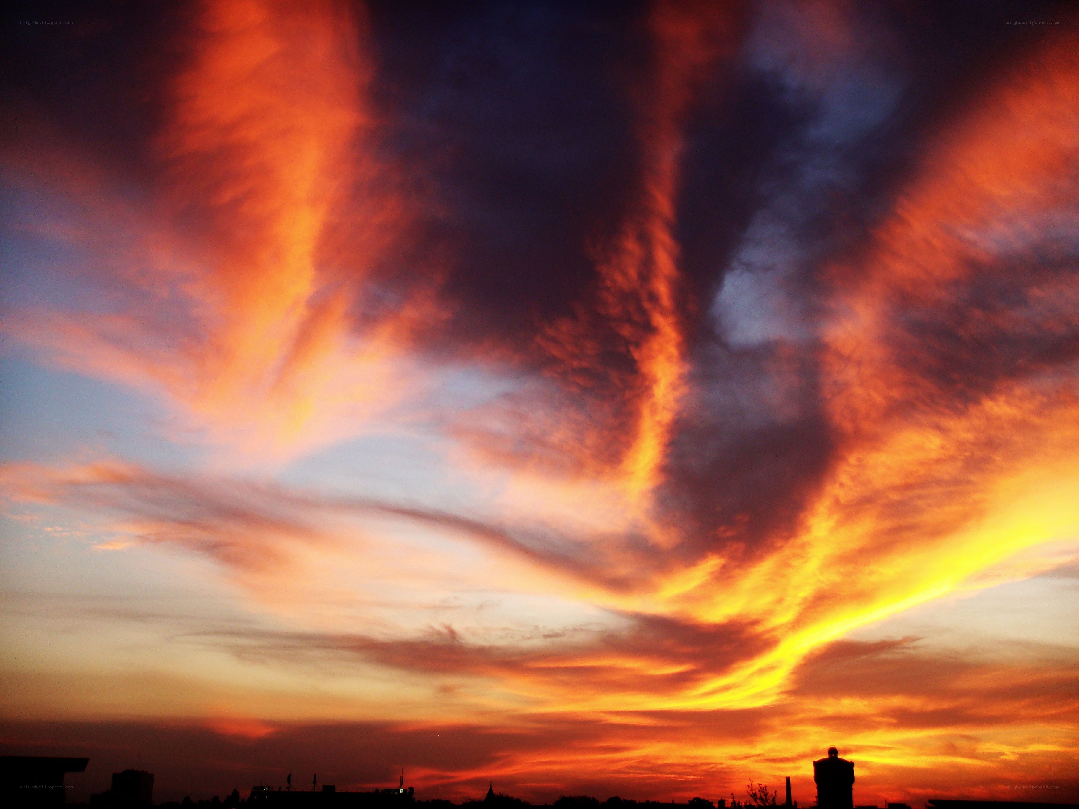 Fiery sunset over city skyline