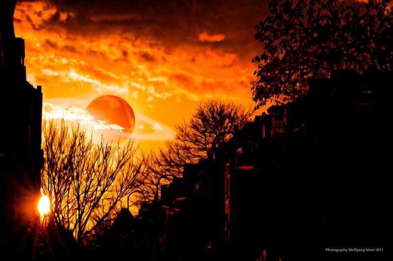 Fiery sunset over city