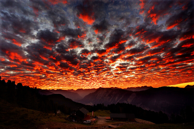 Fiery sunset over mountain valley