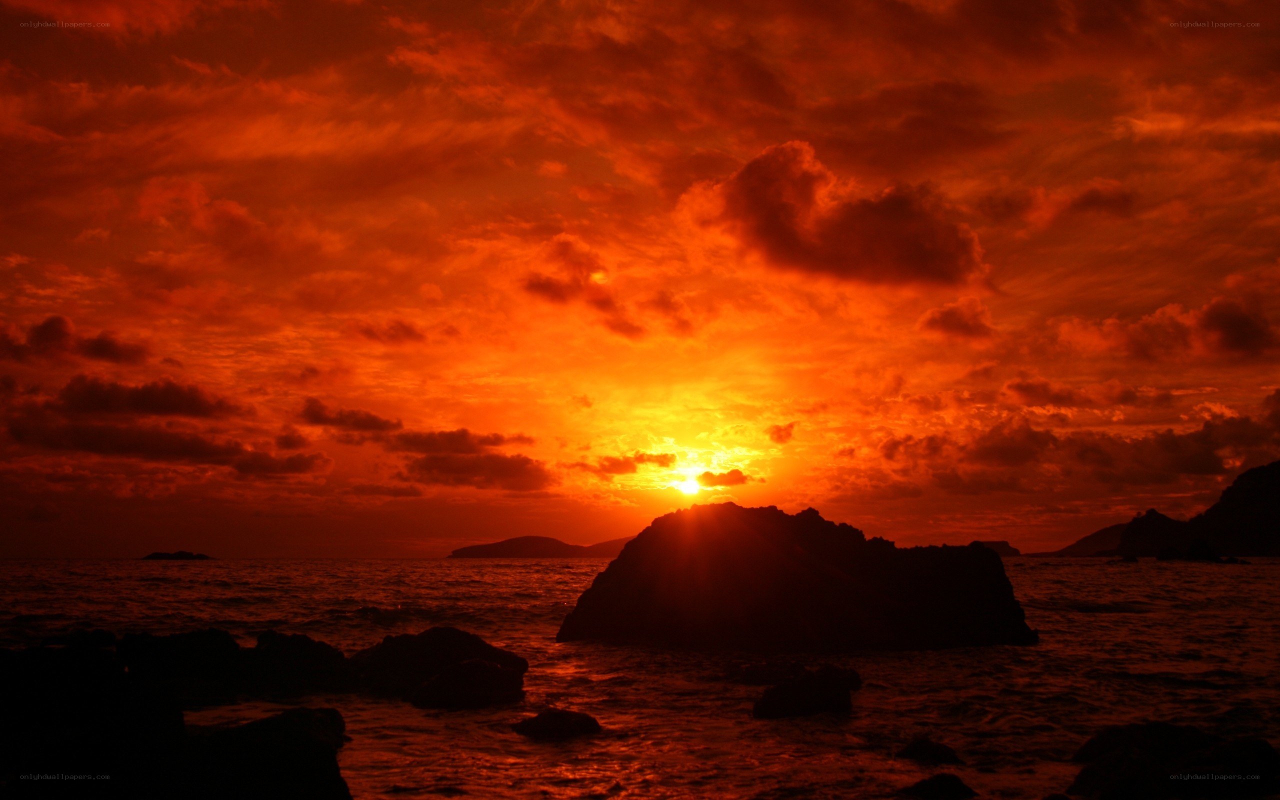 Fiery sunset over rocky coast