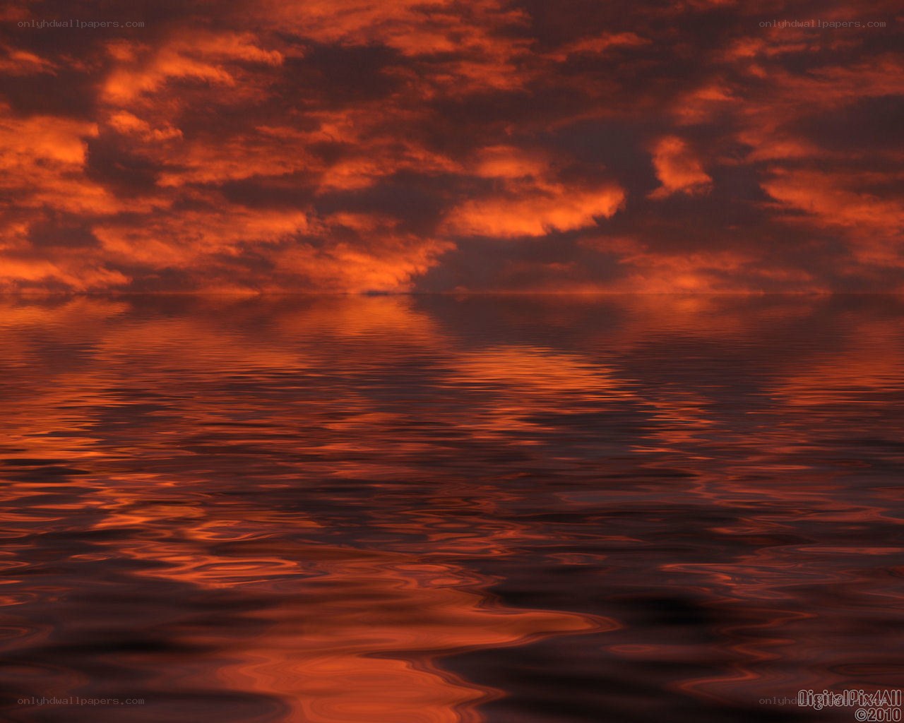 Fiery sunset over water