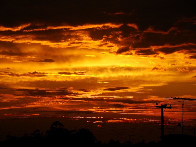Fiery sunset with power lines
