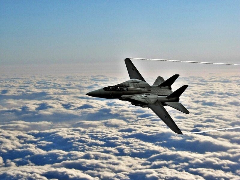 Fighter Jet Above Clouds — Blue