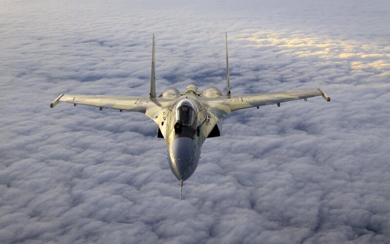 Fighter Jet Above Clouds — Gray, Dramatic
