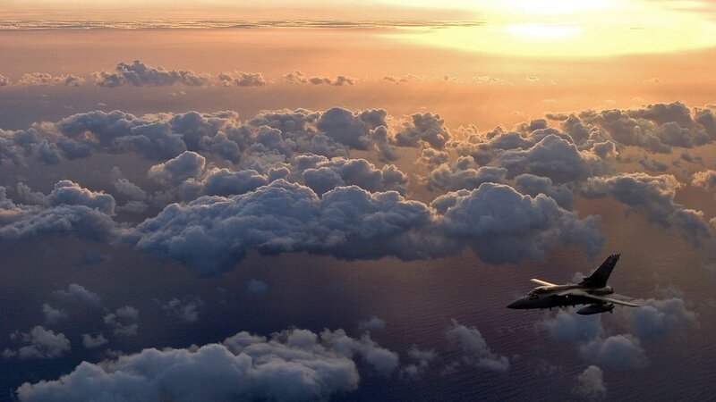 Fighter Jet Above Clouds — Orange, Dramatic, Sunset