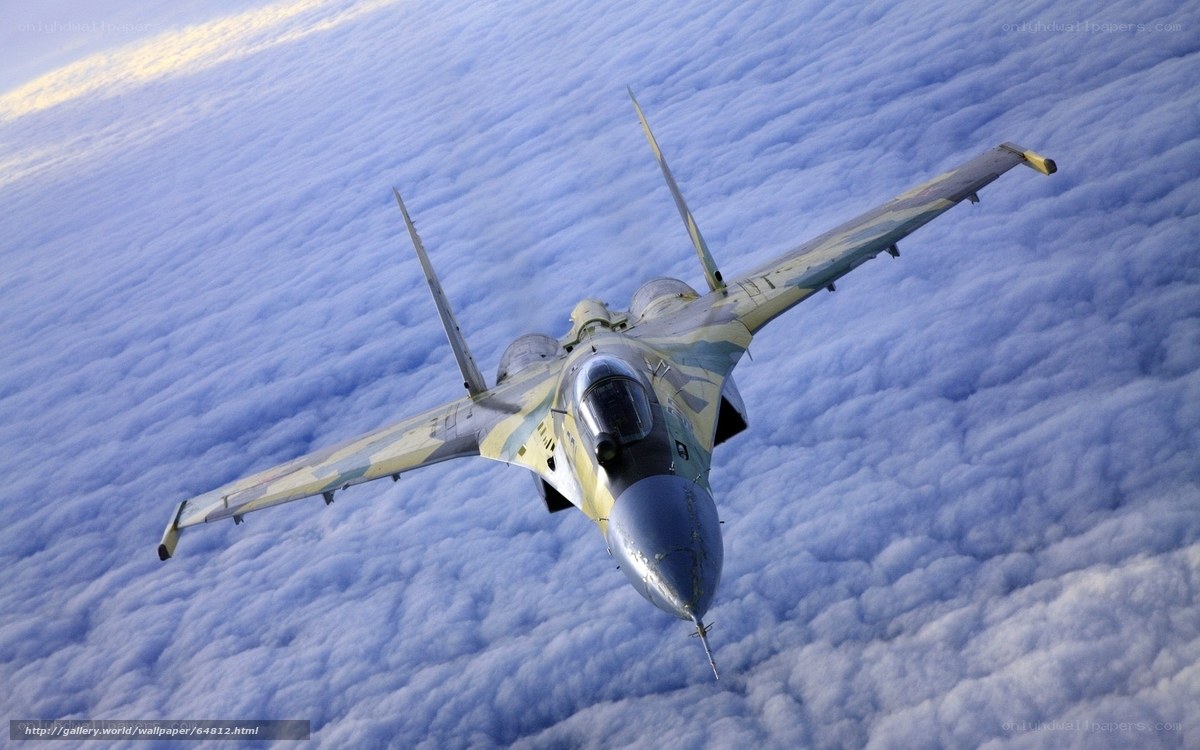 fighter jet above clouds