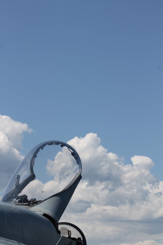 fighter jet cockpit against sky
