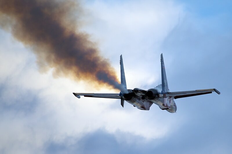 Fighter Jet Emitting Smoke