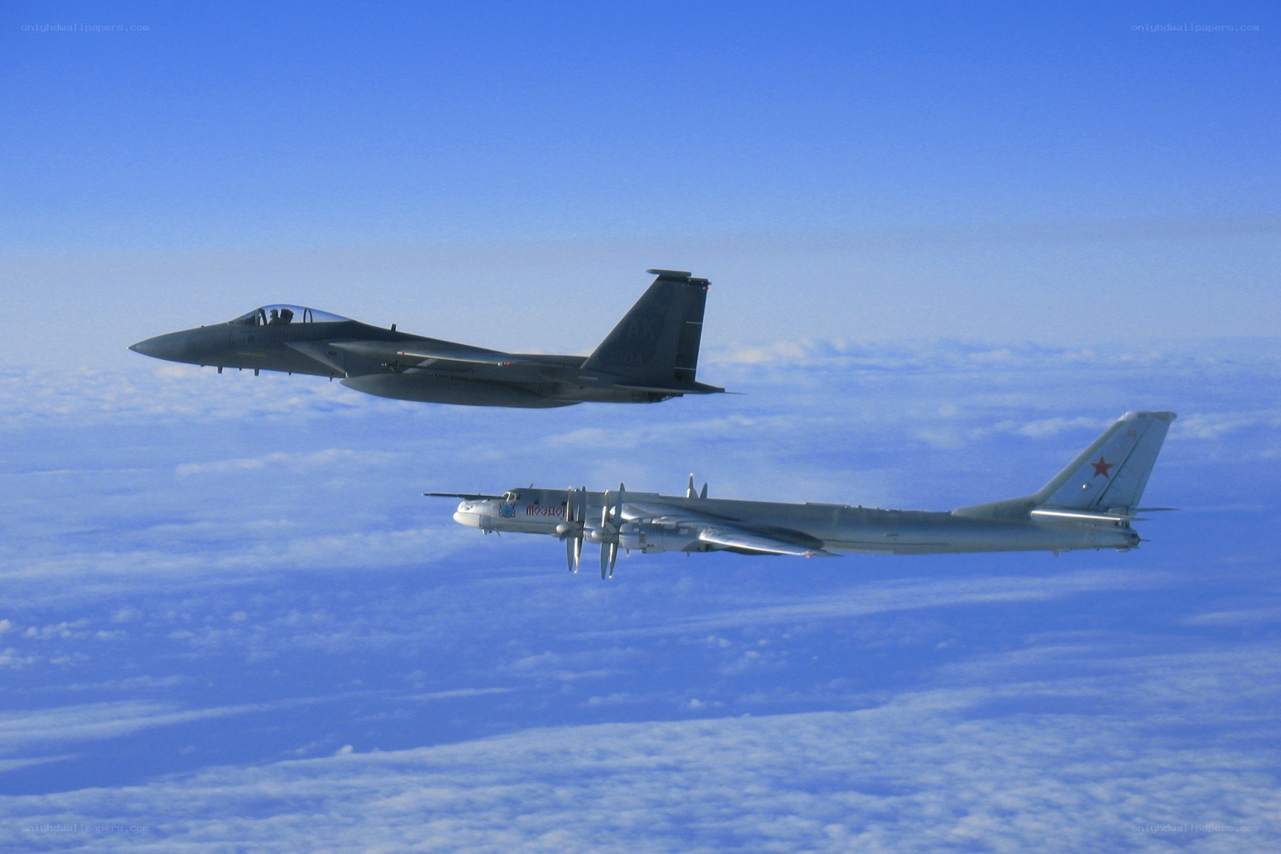 Fighter jet escorting bomber