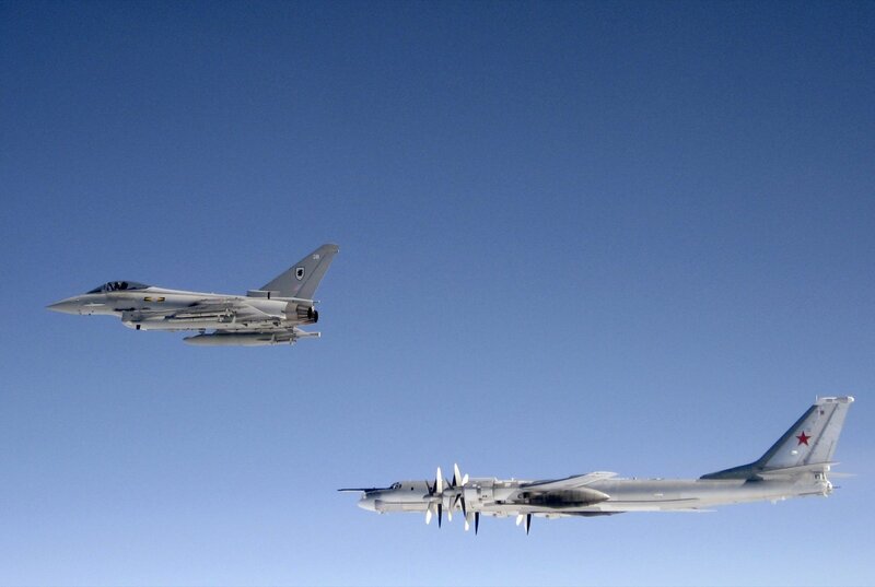 Fighter jet escorting bomber