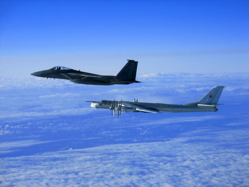 Fighter jet escorting bomber