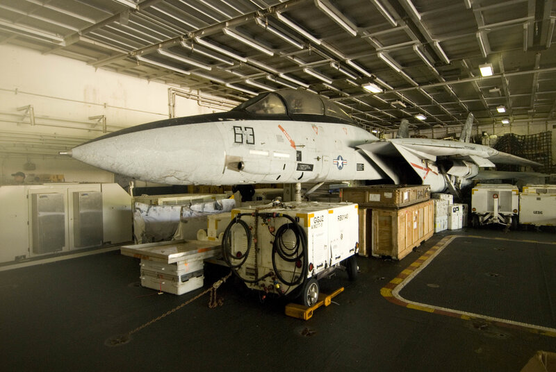 Fighter jet in aircraft carrier hangar