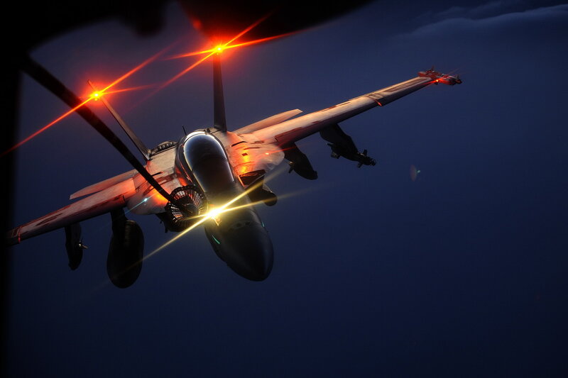 Fighter jet in flight at night