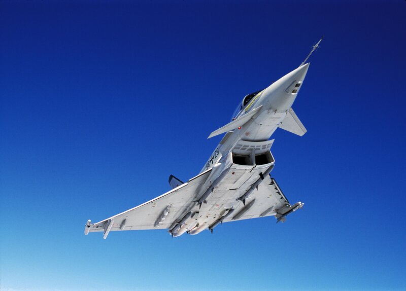 Fighter Jet in Flight — Blue, Dynamic, Afternoon, Photograph, Aircraft, Sky, Missiles