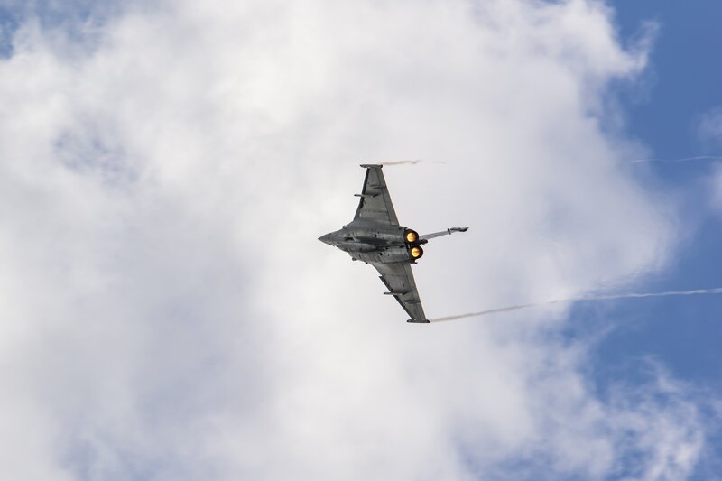 Fighter Jet in Flight — Blue, Dynamic, Afternoon, Photograph, Jet Engine, Clouds