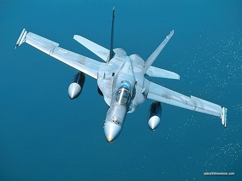 Fighter Jet in Flight — Blue, Dynamic, Afternoon, Photograph, Ocean