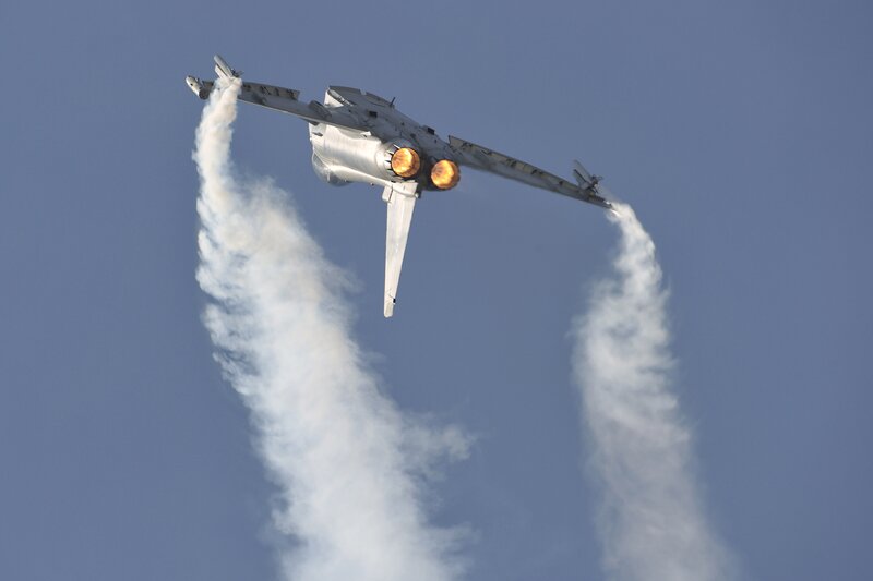 Fighter Jet in Flight — Blue, Dynamic, Afternoon, Photograph, Smoke Trails