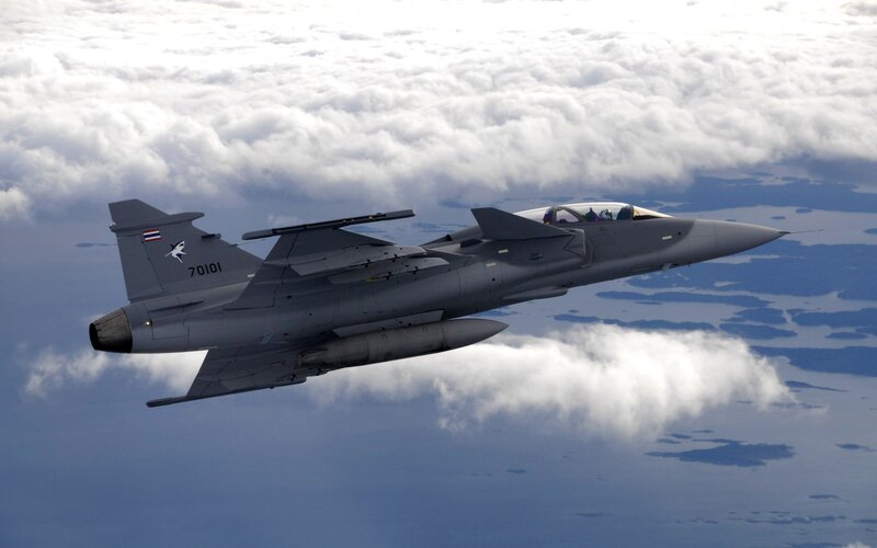 Fighter Jet in Flight — Gray, Dramatic, Afternoon, Photograph, Clouds, Sky, Ocean