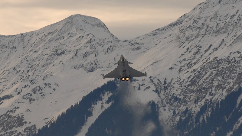 Fighter Jet in Mountains