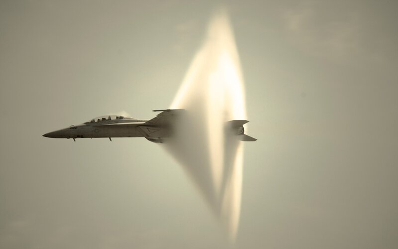 Fighter Jet in Supersonic Flight — Gray, Dramatic, Photograph