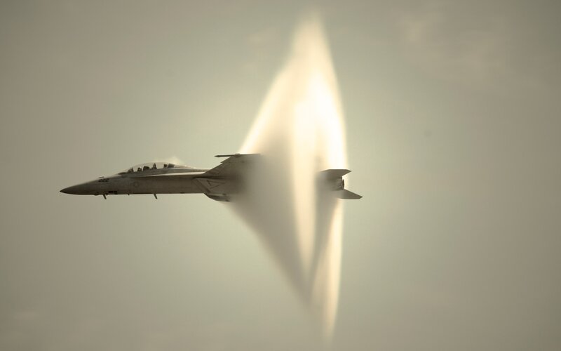 Fighter Jet in Supersonic Flight — Gray, Dramatic