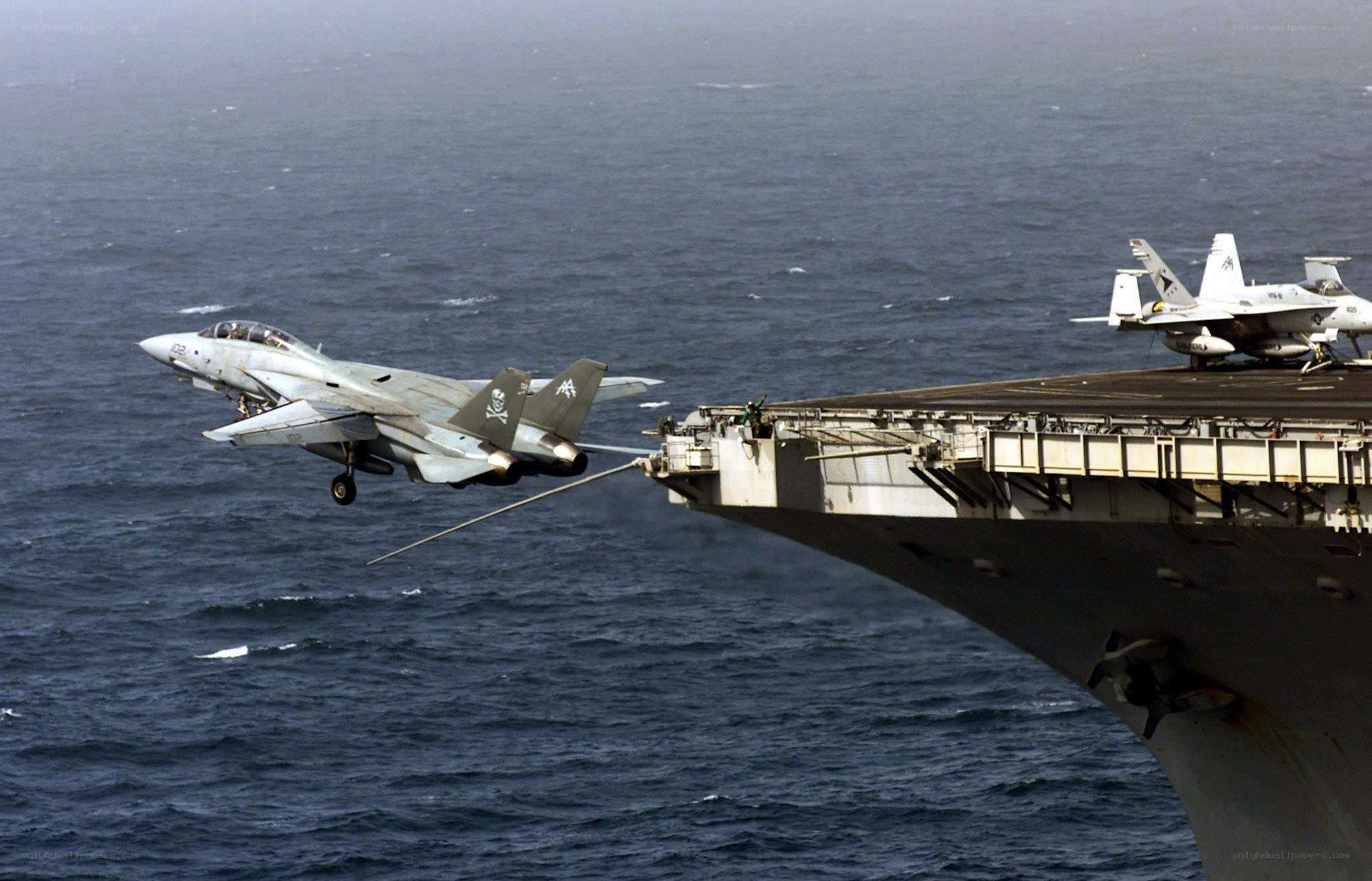 Fighter jet launching from aircraft carrier
