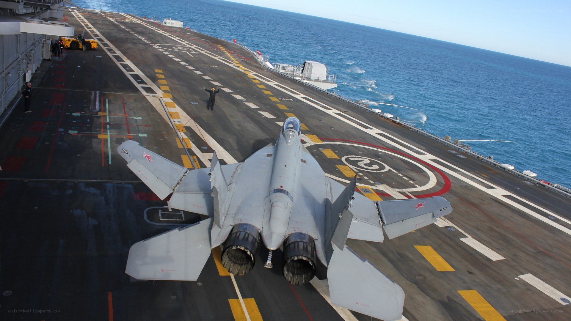 Fighter jet on aircraft carrier deck