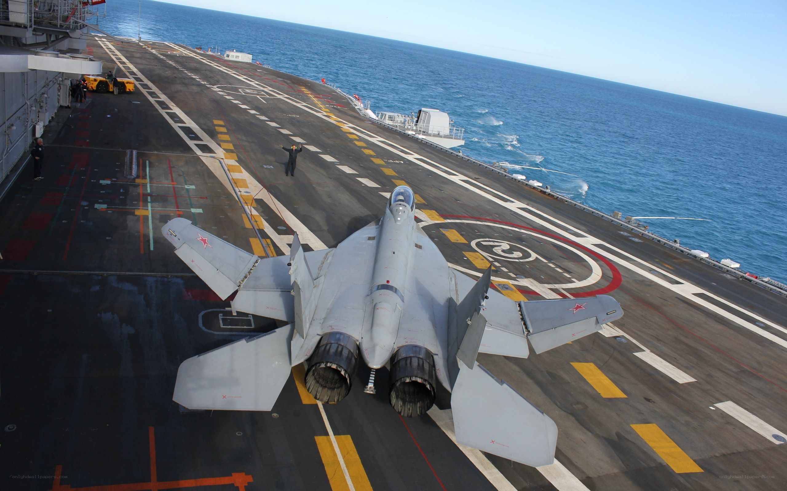 Fighter jet on aircraft carrier deck