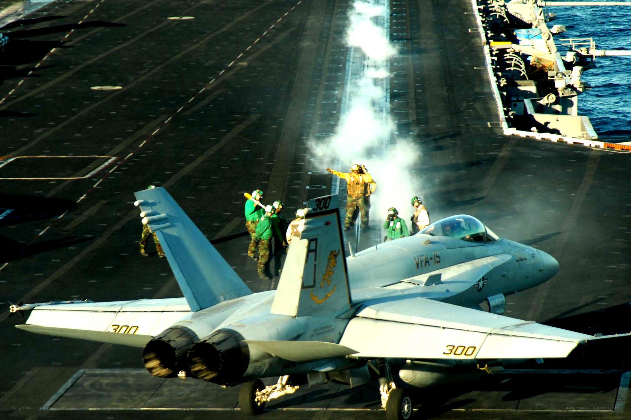 Fighter jet on aircraft carrier deck