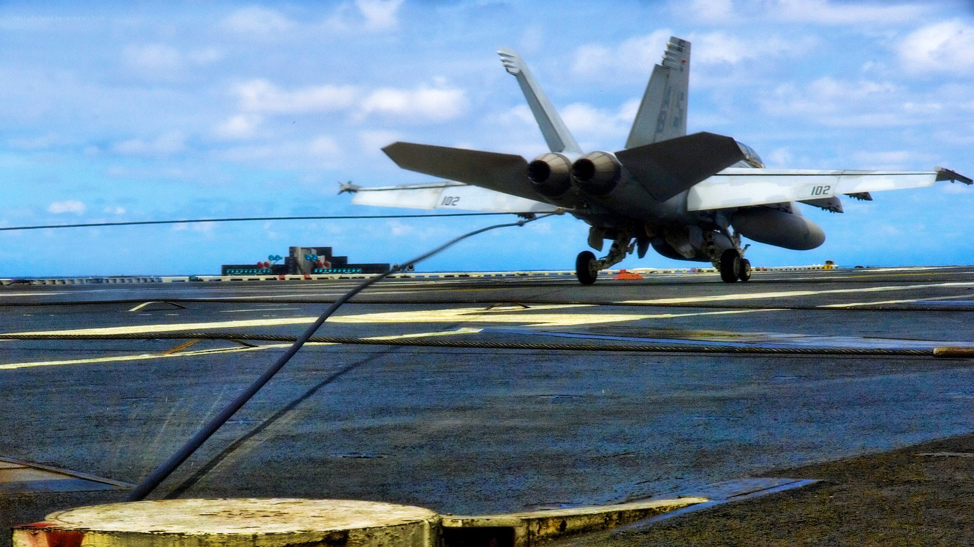Fighter jet on aircraft carrier deck