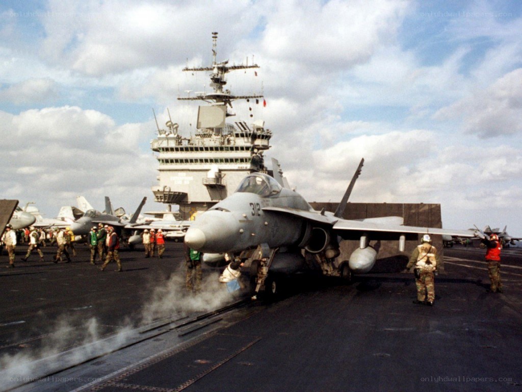 Fighter jet on aircraft carrier deck