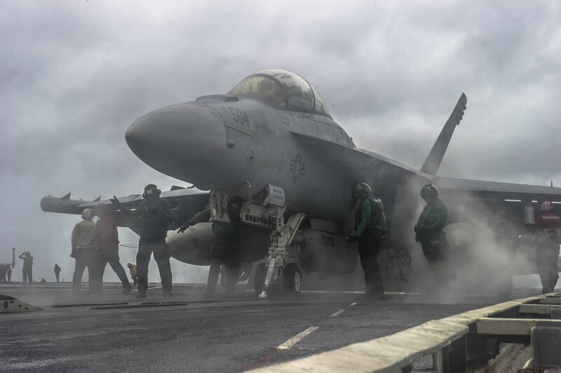 Fighter Jet on Aircraft Carrier — Gray, Dramatic, Photograph, Military Personnel, Smoke