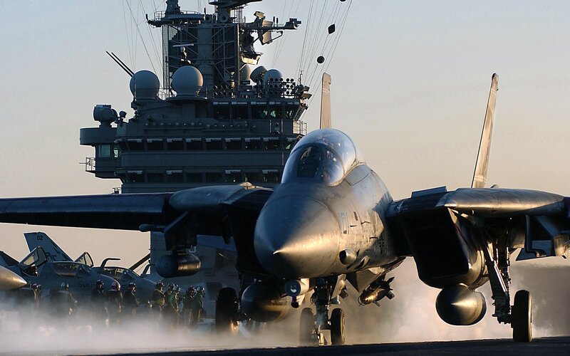 Fighter Jet on Aircraft Carrier — Gray, Dramatic, Sunset, Photograph, Aircraft Carrier, Crew, Smoke